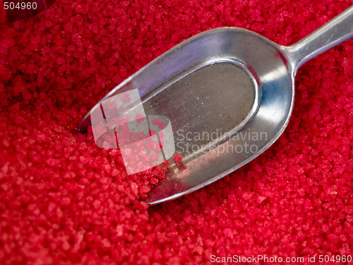 Image of scoop in red candy