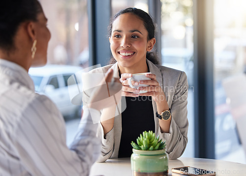 Image of Coffee shop, meeting and happy women in conversation, b2b networking and business planning or collaboration. Professional biracial people or entrepreneur in restaurant, cafe or remote workspace talk