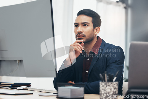 Image of Business, concentration and man at computer thinking or brainstorming ideas for online project. Planning, analytics and Indian businessman, internet search for startup idea sitting at desk in office.