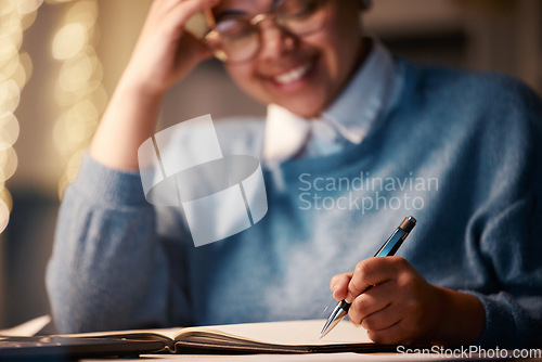 Image of Business student, notebook or writing in night home office for scholarship finance, planning studying or education loan investment. Smile, happy or working late woman on learning accounting balance