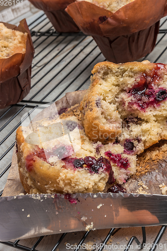 Image of Muffins with red fruits jam fill.