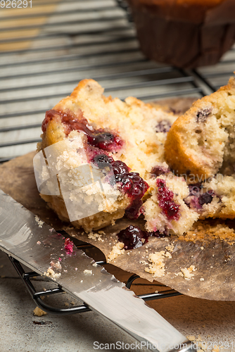 Image of Muffins with red fruits jam fill.