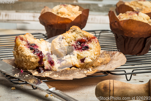 Image of Muffins with red fruits jam fill.