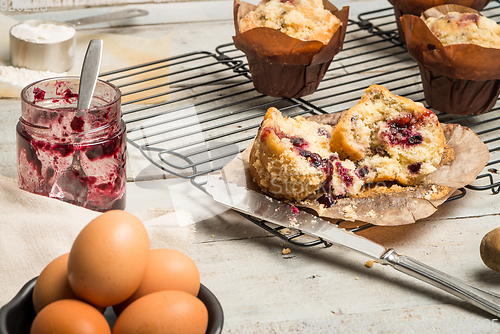 Image of Muffins with red fruits jam fill.