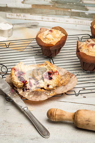 Image of Muffins with red fruits jam fill.