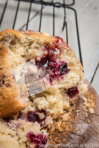 Image of Muffins with red fruits jam fill.