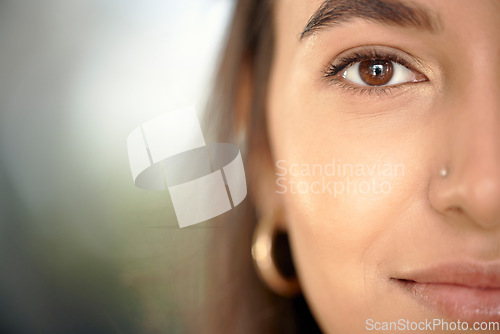 Image of Business woman, portrait and face closeup with mock up and eye vision with blurred background. Young female, gen z person and entrepreneur with beauty and facial piercing feeling relax with mockup