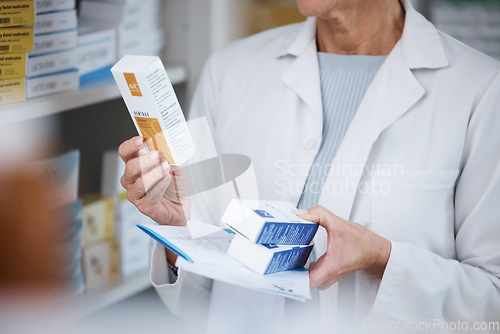 Image of Pharmacy, pharmacist and hands with medicine, pills or box in drugstore or shop. Healthcare, wellness and medical doctor, female or woman holding medication, product or drugs, vitamins or supplements