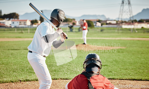 Image of Baseball, bat and ready with a sports man outdoor, playing a competitive game during summer. Fitness, health and exercise with a male athlete or player training on a field for sport or recreation