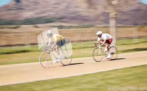 Image of Two men cycling with motion blur in nature, countryside and sports of triathlon competition, race and training. Bike team, bicycle speed and action of energy, performance and travel on mountain path