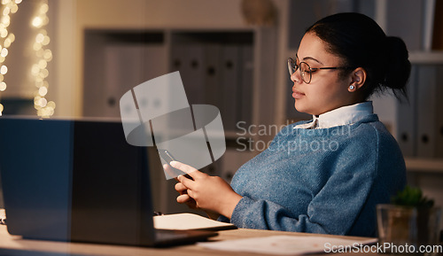 Image of Business woman, phone and typing in office at night, texting or social media in workplace. Bokeh, overtime technology and female employee with mobile smartphone for web scrolling or internet browsing