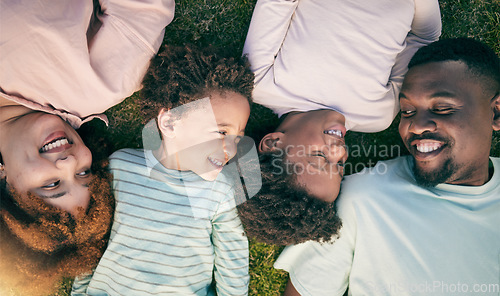 Image of Smile, happy black family on grass from above mother, father and children lying together. Weekend, relax and people in garden, top view of woman, man and kids with happiness and love in South Africa.