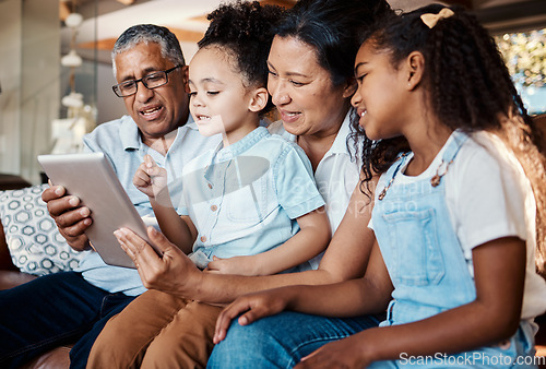 Image of Relax, family tablet and grandparents with girls on sofa in home living room for social media or video streaming. Technology, care and happy grandfather, grandma and kids bonding with touchscreen.