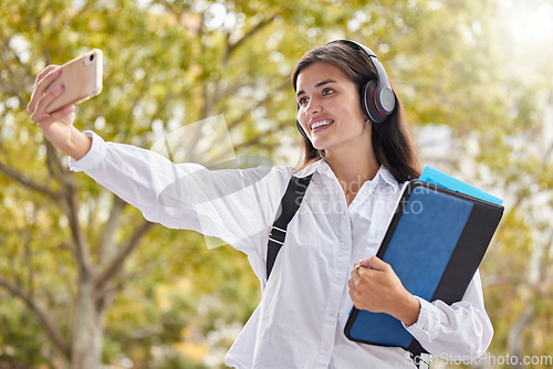 Image of Student, woman and smile for selfie at university, outdoor and happy for social network ui, web or excited in summer. Young gen z girl, influencer and profile picture at campus with books in sunshine