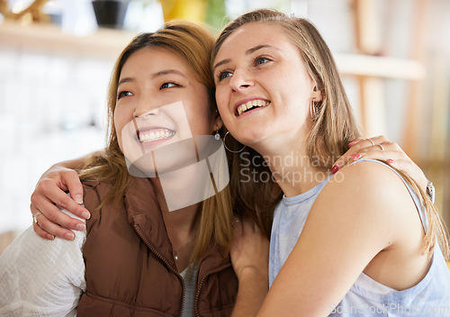 Image of Smile, friendship and women hugging in cafe, happy, love and weekend fun for asian woman and friend. Hug, laugh and diversity, smiling friends embrace and relax in restaurant for brunch date at table