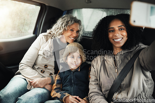 Image of Selfie, smile and family on a road trip in a car for bonding, quality time and a getaway together. Happy, travel and mother, grandmother and a child taking a photo on vacation for social media