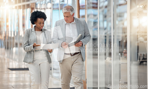 Image of Finance, planning and business people walking with bookkeeping budget, financial quote or invoice information. Manager, black woman or accountant partner talking of finance receipt or document advice