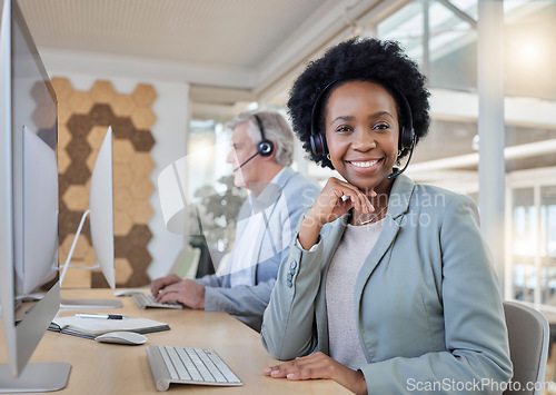 Image of Help desk, smile and portrait of confident black woman at computer with headset at call center. Customer service consultant at online crm office, leader at advisory agency with diversity and success.