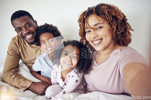 Image of Black family, selfie smile and portrait in home bedroom, bonding and having fun together. Interracial, love and father, mixed race mother and children taking pictures for happy memory or social media