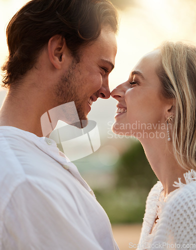 Image of Happy, love and couple in nature with admiration, laughing and bonding in the countryside of Spain. Smile, care and man and woman looking caring, playful and dating in a park with happiness together