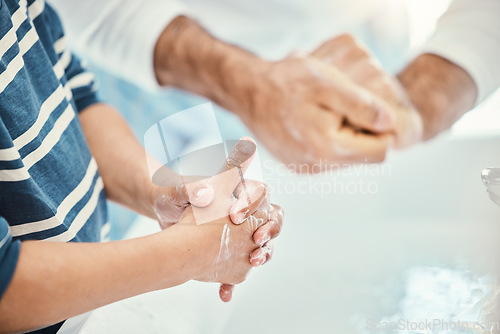 Image of Family, cleaning hands and washing in sink in bathroom for health, hygiene and wellness. Water splash, children and father with kid to wash with soap for disinfection, sanitize or skincare in house.