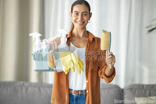 Image of Portrait, cleaner and woman cleaning home smile with equipment, housework and person happy for hygiene clean house. Maintenance, service and disinfectant product by maid in living room housekeeping