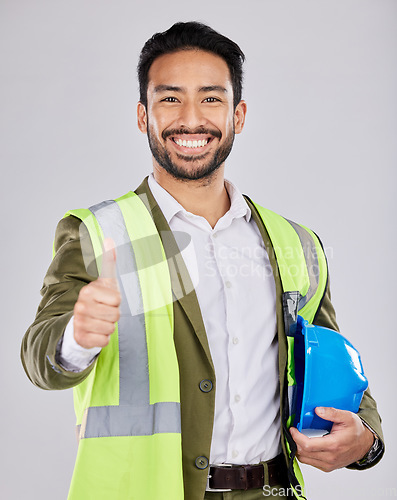 Image of Portrait, civil engineering or happy man in studio with thumbs up, smile or real estate building success. Winning designer, architecture or contractor project management goals, agreement or like sign