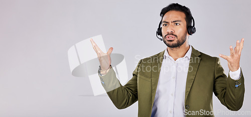 Image of Confused, question and frustrated man call center agent angry isolated against a studio grey background and stress. Employee, ask and rude customer service worker or consultant annoyed at work