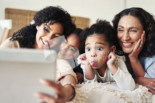 Image of Funny, black family home and selfie with mother, kids and grandmother with happy bonding on bed. African children, mama and grandma with social media, profile picture and comic happiness with tablet