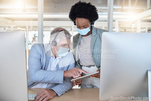 Image of Covid, call center and coaching employees with mask at computer, help for senior man and black woman with tablet. Compliance, consulting and sharing opinion for medical advisory agency with diversity