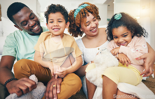 Image of Black family, smile and living room sofa with bonding, parent love and care in home. Lounge, happiness and children with mom and dad together feeling happy with a hug on a couch with mama and dada