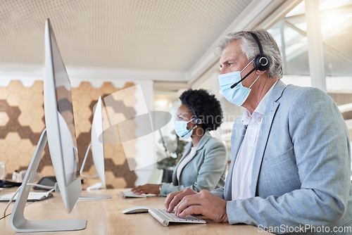 Image of Covid, call center employees with mask at computer and senior man with black woman in headset. Office compliance, consulting team online in shared workspace and medical advisory agency with diversity