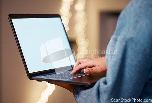 Image of Laptop, hands typing and green screen mock up in office for advertising, marketing or product placement at night. Bokeh, branding or business woman with computer for mockup or copy space in workplace