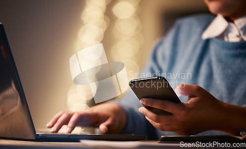 Image of Hands, business phone and laptop in office for web browsing, research or social media. Night bokeh, cellphone or woman, professional or employee with mobile smartphone for internet scrolling online.
