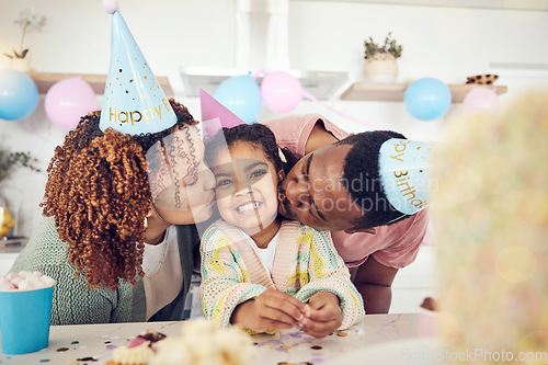 Image of Birthday, party and kiss with black family in kitchen for celebration, bonding and affectionate. Happiness, excited and care with parents and child at home for surprise, fun and special event