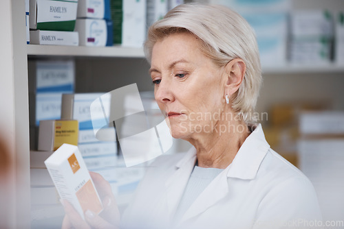 Image of Elderly pharmacist, medicine reading and stock in a healthcare, wellness and pharmaceutical store. Pharmacy inventory, working senior woman and medical product check of a employee at a drugstore