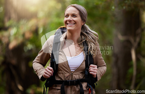 Image of Hiking, happy and forest with a woman outdoor, walking in nature or the wilderness for adventure. Freedom, location and woods with an attractive young female hiker taking a walk in a natural park