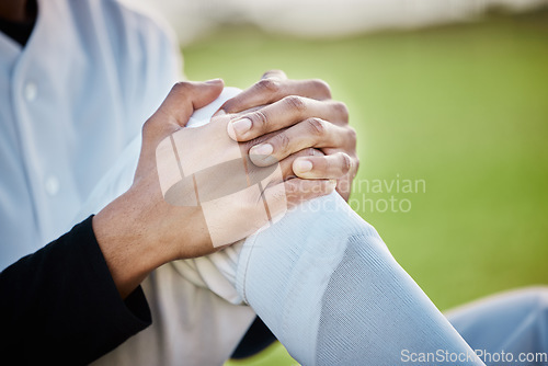 Image of Baseball, pain and hands with knee injury on field after accident, fall or workout in match. Sports, training and player man with fibromyalgia, inflammation or broken leg, arthritis or tendinitis.