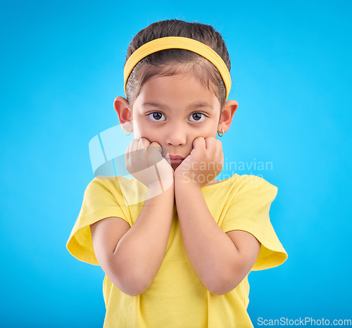 Image of Mockup, portrait and girl nervous, scared and overwhelmed against a blue studio background. Face, female child and kid with anxiety, stress and worried with mental health, anxious and panic reaction