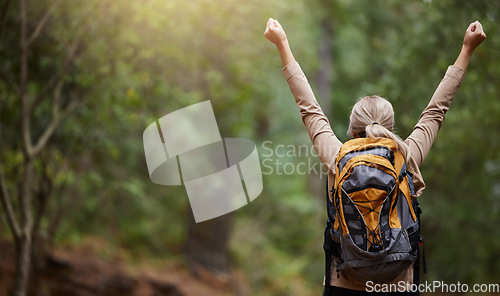 Image of Back of woman, hiking and arms of freedom, success and hope of courage, achievement and mockup. Hiker celebrate travel, motivation and inspiration of goals, wellness and energy of adventure in forest