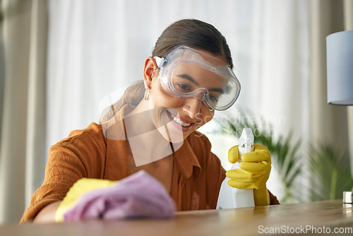 Image of Woman, cleaner and spray table with cloth, happy and cleaning service in home living room for job. Hands, bottle and working with product for dust, bacteria and wood furniture with happiness in house