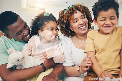 Image of Black family, kids smile and living room sofa with bonding, parent love and care in home. Lounge, happiness and children with mom and dad feeling happy with a hug on a couch with mama and father