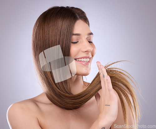 Image of Smile, beauty and haircare of a woman with straight hair in studio isolated on a background. Natural cosmetics, growth or happy female model with salon treatment for healthy keratin or long hairstyle