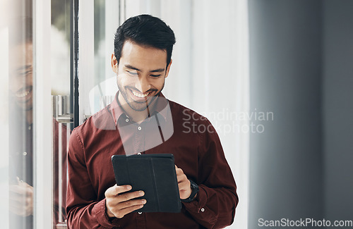 Image of Tablet, window and smile, Indian businessman, happy and reading email or funny social media meme online. Startup office, development and assessment for property design project, architect networking.