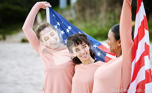 Image of Volleyball woman, team and american flag at beach, happiness and pride for celebration, winning or goal. Women, sports and diversity with support, solidarity or teamwork for winner with excited smile