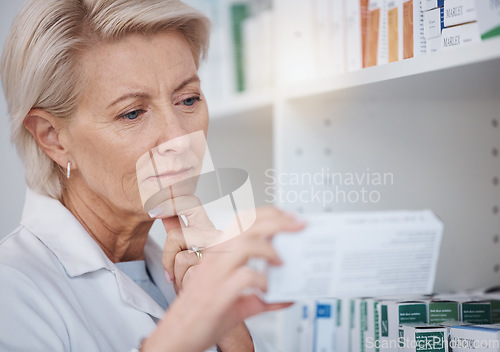 Image of Pharmacy, pharmacist and woman reading medicine label, pills or box in drugstore. Healthcare, thinking and elderly medical doctor looking at medication, antibiotics or drugs, vitamins or supplements.