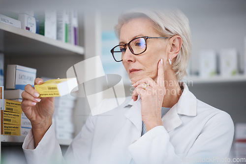 Image of Pharmacy, pharmacist and woman reading medication label, pills or box in drugstore. Healthcare, wellness and elderly medical doctor looking at medicine, antibiotics or drugs, vitamins or supplements.