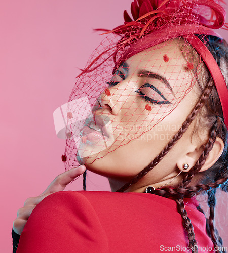 Image of Stylish, fashion and a woman with a face net isolated on a pink background in a studio. Fashionable, style and model with headwear and a veil on a hat as a fancy, classy and elegant accessory