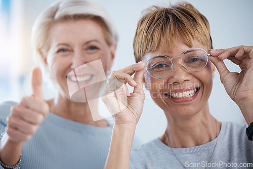 Image of Portrait, thumbs up and senior women with glasses for vision, optometry or wellness in optics store. Healthcare face, hand emoji and smile of happy female with optometrist for success, ok or approval