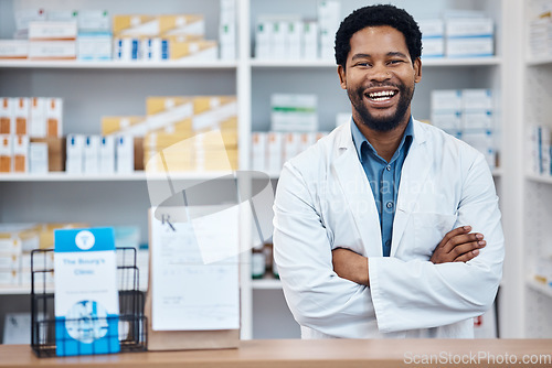 Image of Pharmacy portrait, medicine package and happy man in drugs store, pharmaceutical shop or healthcare dispensary. Hospital retail product, stock pills and African pharmacist for medical help support